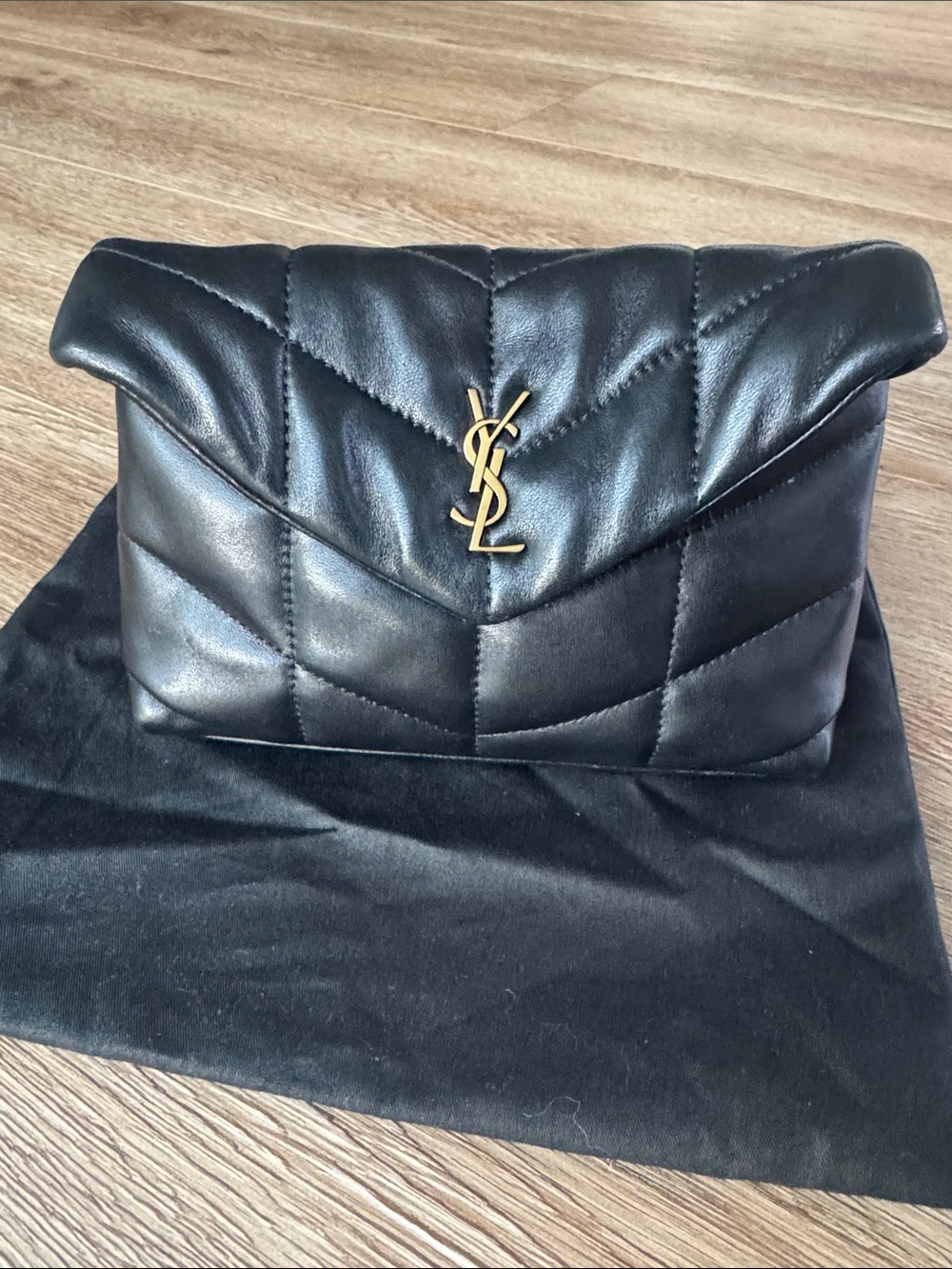 Saint Laurent Black Quilted Lambskin Clutch with Gold YSL Accent
Small 8”x 5” - Picture 5 of 6